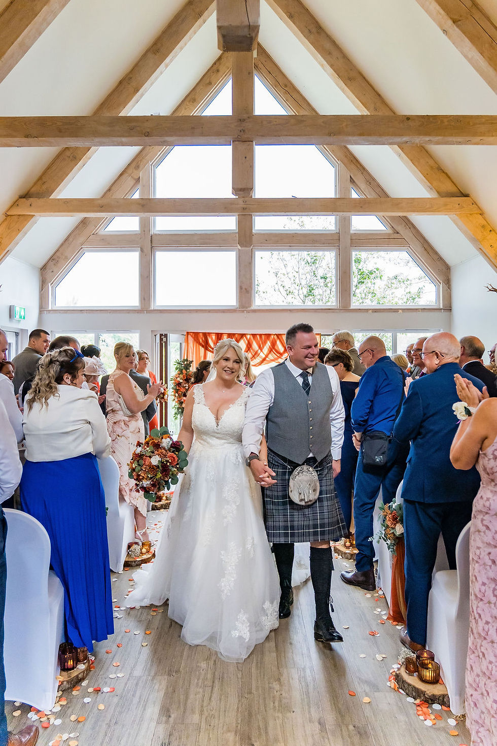 Newlywed exit at the wedding of Forbes of Kingennie in Angus, photographed by ZibiZ Photo.
