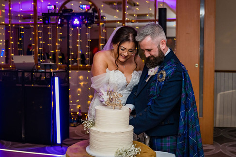 Cake cutting during the wedding reception at the Woodlands Hotel in Dundee.