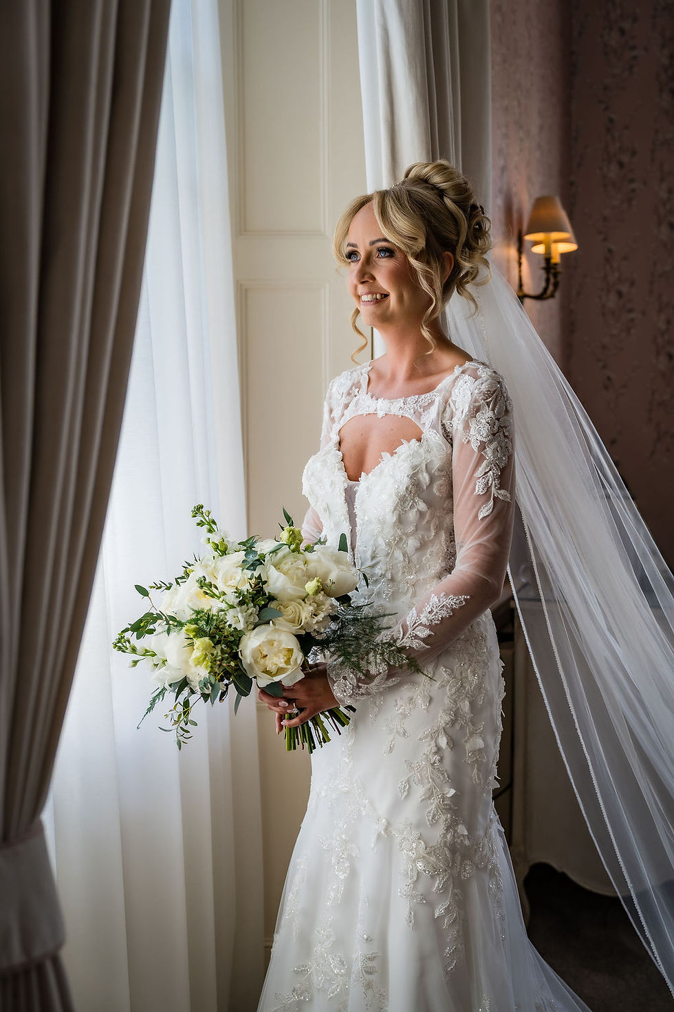 Bride portrait by window light before ceremony at Balbirnie House in Scotland, calm and emotional moment