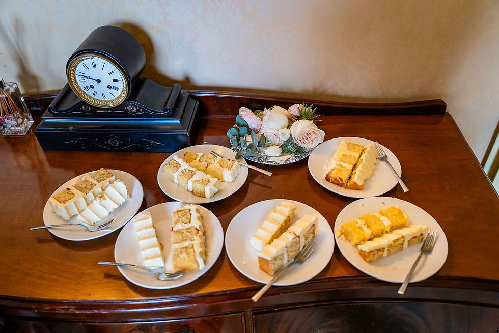 Wedding cake cut into slices ready to be served at Bardmony Estate, relaxed reception moment in Scotland