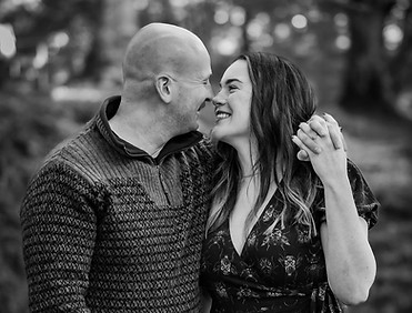 Engaged couple laughing together during autumn engagement photoshoot in Scotland, natural pre-wedding portraits.