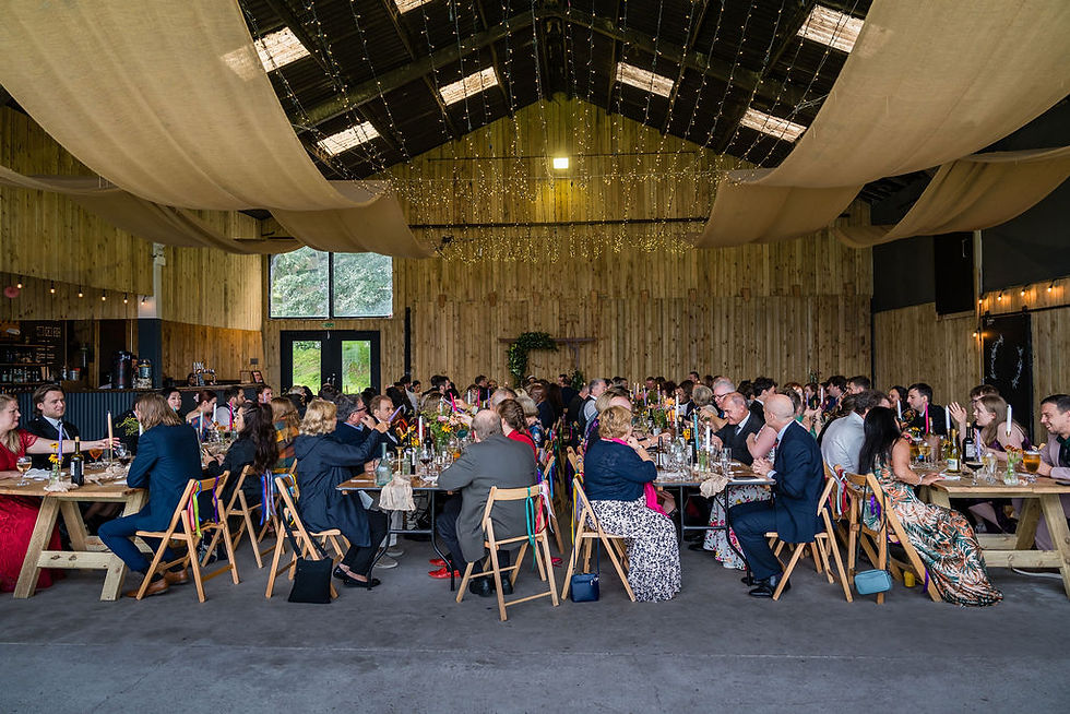 Wide view of the wedding reception room with all guests seated and listening to speeches at Boreland Loch Tay