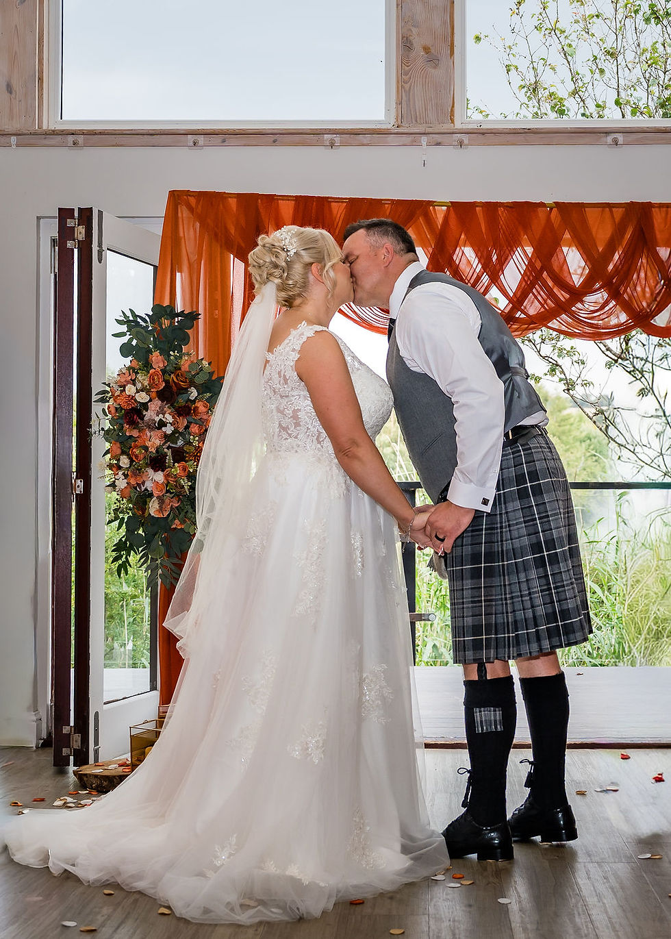First kiss as newlyweds at Forbes of Kingennie in Angus, captured by Scotland wedding photographer ZibiZ Photo.