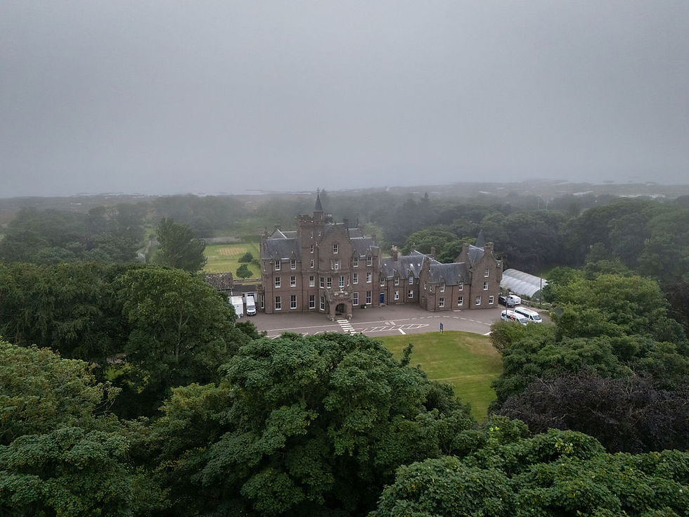 Aerial view of Brotherton Castle and its surrounding grounds on a Scottish wedding day.