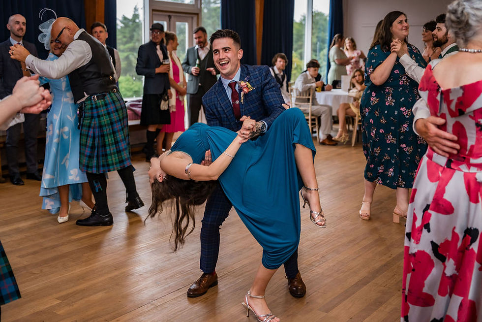 Friends and family enjoying the dance floor during the evening celebrations at the wedding reception.