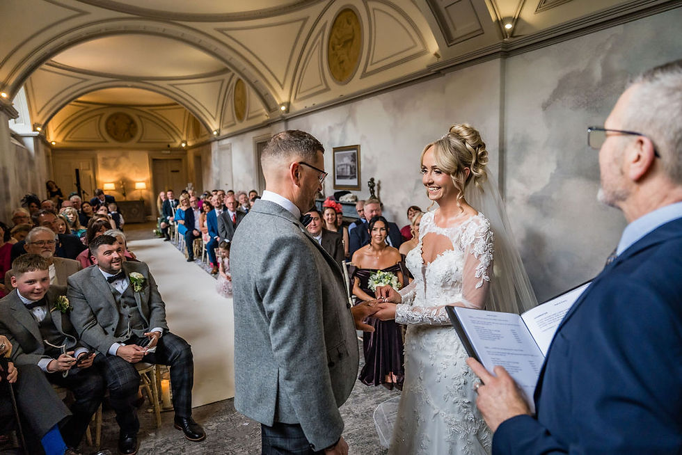 Bride and groom exchanging rings during emotional ceremony at Balbirnie House wedding in Scotland