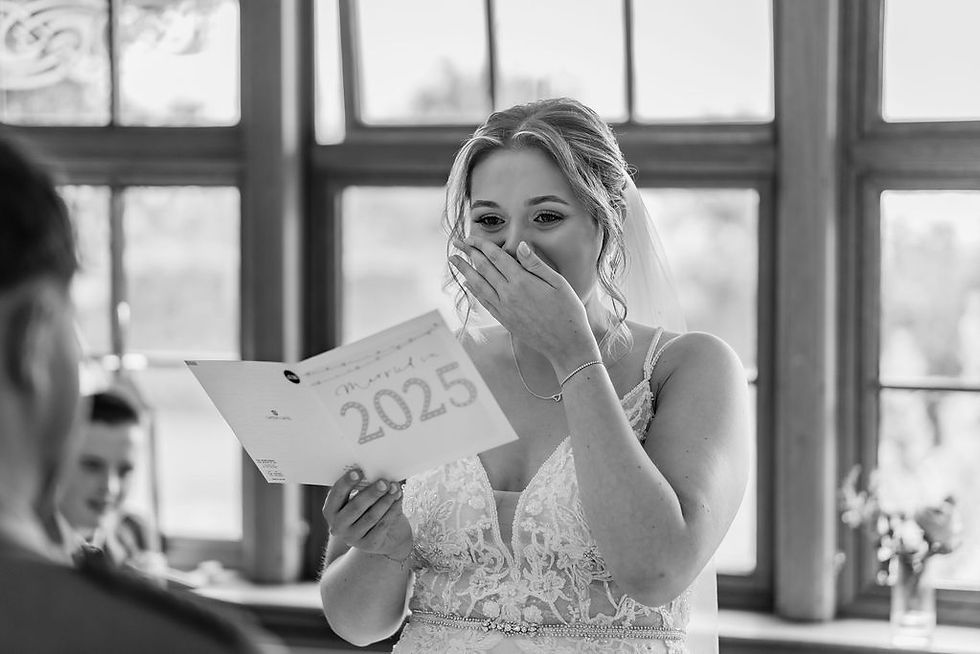 Bride cries while exchanging vows during an intimate wedding ceremony at The Inn at Charlestown