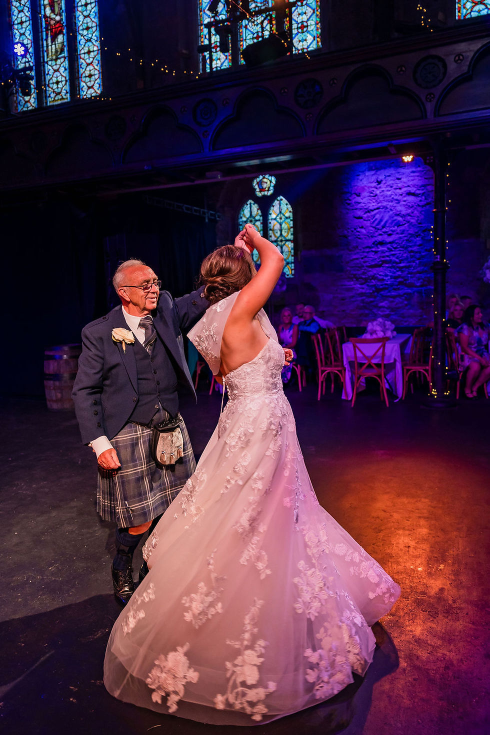 Father and daughter dance together during the wedding reception at Cottiers in Scotland