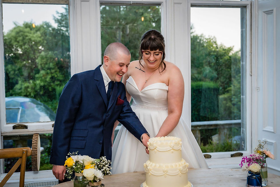 Bride and groom cutting their wedding cake during Taypark House reception, photographed candidly.