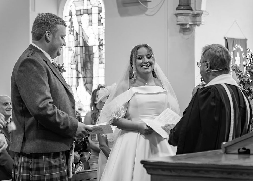 Bride laughing during relaxed portrait moment at church wedding near Carnoustie