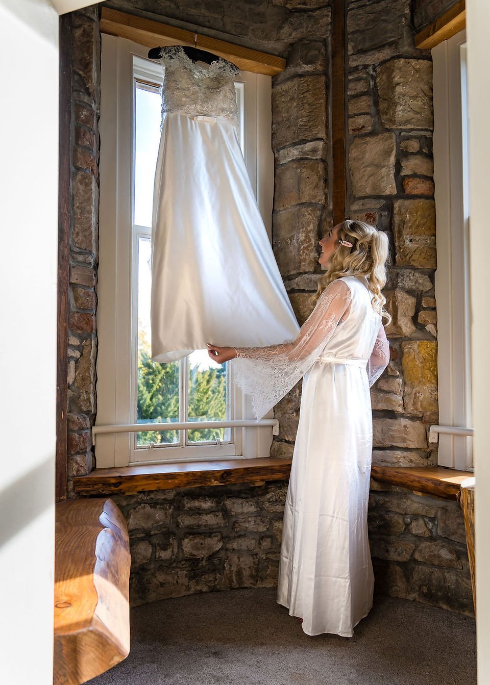 A bride admiring her wedding dress at Taypark House in Dundee
