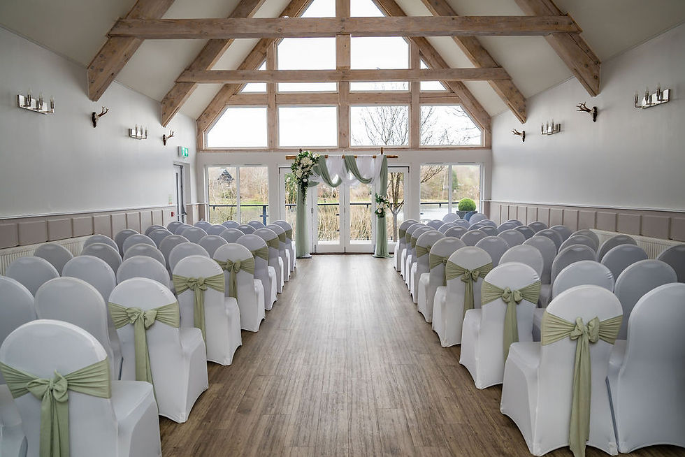 Indoor ceremony room set up for a wedding at Forbes of Kingennie near Dundee, Scotland, decorated and ready before guests arrive.
