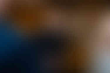 Wedding magician entertaining the newlyweds with a card trick during the reception.