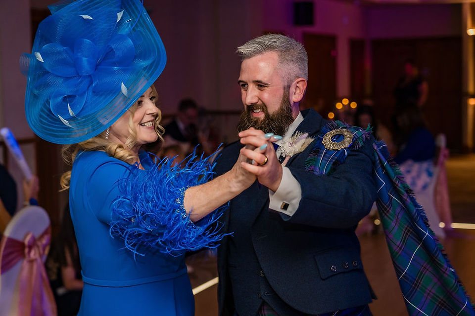 Groom dancing with bride mum during the wedding reception at the Woodlands Hotel.