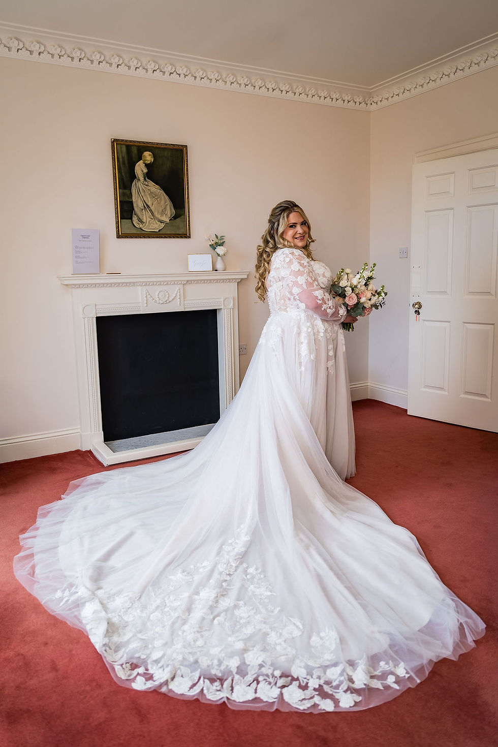 Bride looking over her shoulder showing full wedding dress at Bardmony Estate, elegant bridal portrait Scotland
