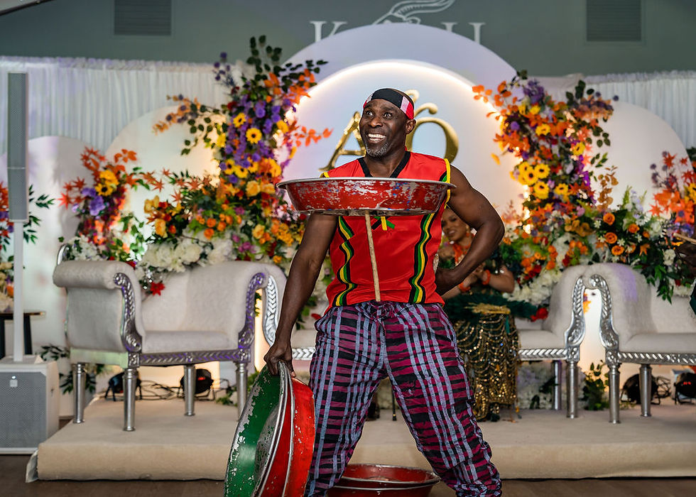 High-energy African acrobatic dance performance at a Nigerian Igbo wedding in Scotland, photographed at Kinmount House.