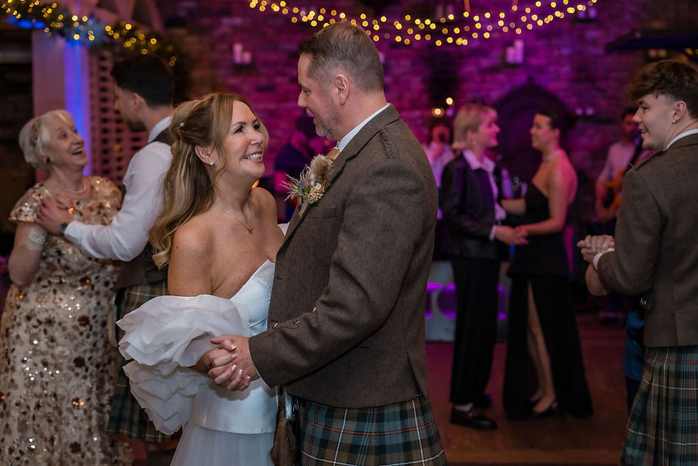 Bride and groom dancing with guests during the evening celebrations at Forgan’s Broughty Ferry.