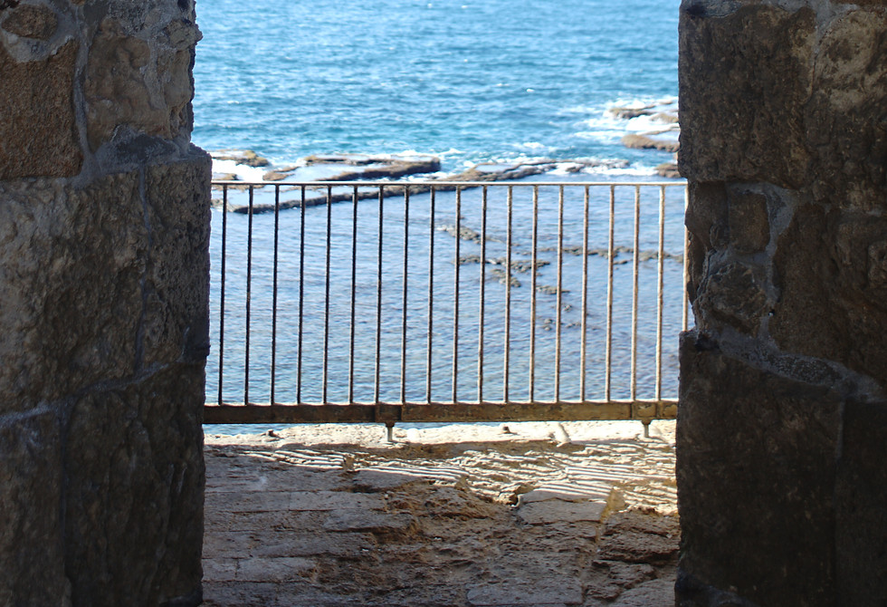 Old wall opening to sea