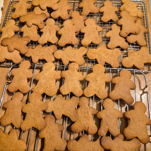 7 batches of gingerbread men baked, ready for decorating