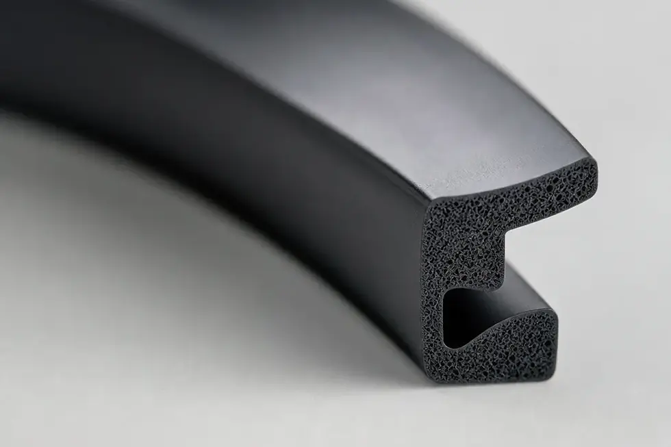 Macro photograph of a precise FKM gasket cross-section on a clean workbench, soft diffused studio lighting, minimal indu