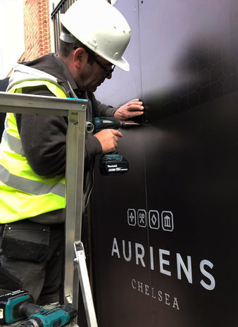 auriens working on hoarding 2.jpg
