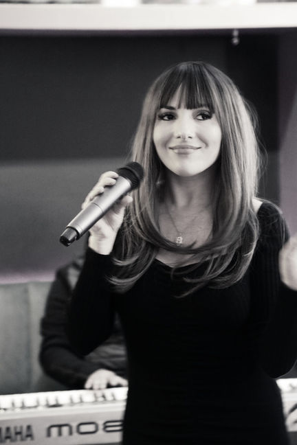 DJ vocalist Dani B performing live vocals while DJing in Cape Town