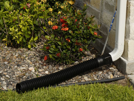 Gutter, Downspout and Flex hose protecting flowerbed by guiding water away