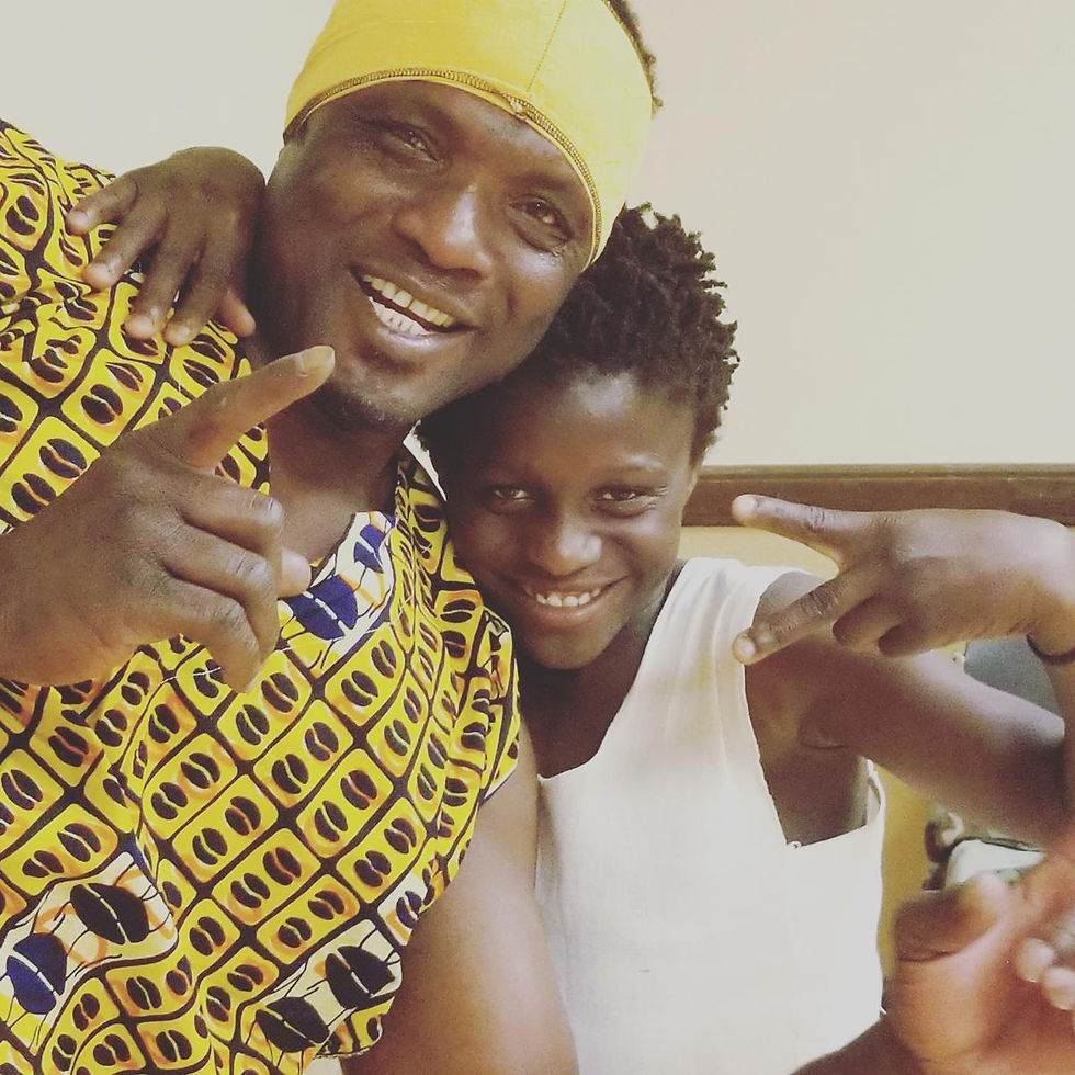 photo of Alseny Yansane and his son , Papa