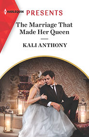 Book cover of The Marriage That Made Her Queen. Woman in a tiara and evening gown and man in a suit in romantic setting.