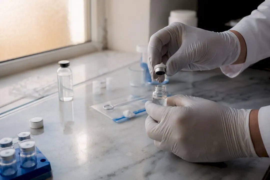 Hands weighing lyophilized peptide powder