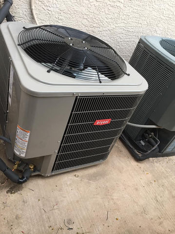 Two outdoor Bryant air conditioning units on a concrete surface.