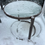 Thumbnail: EM - 054 - Pair Of Metal Outdoor Tables - 1 Has Glass - Pictured Sep.