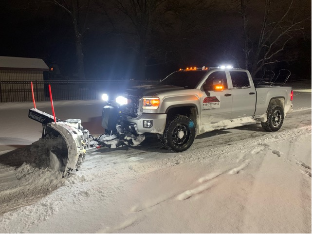 American Snow Removal plowing snow at night