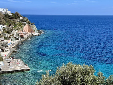 A panoramic photo of Asteria beach captured from the top of the stairs at Vaporia