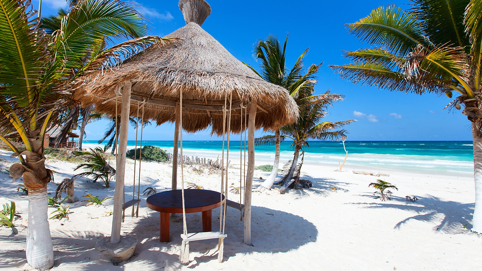 Beach Hut with swing seats on the beach in the Caribbean