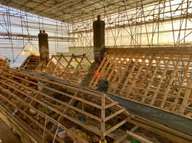 Thatched roof under cover during winter