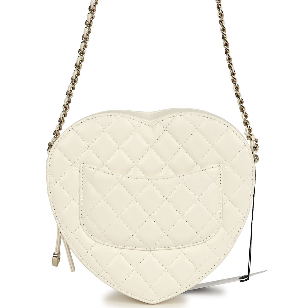 Thumbnail: Angled front view of the white lambskin heart bag on its chain-and-leather strap