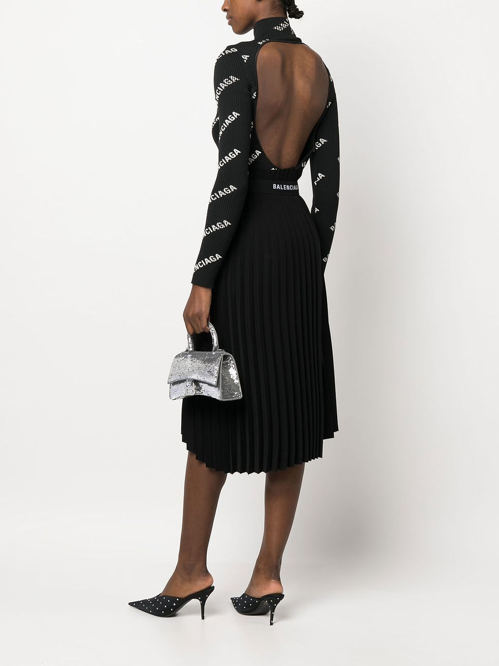 Thumbnail: Balenciaga Hourglass XS silver sequin bag, held by a model from behind
