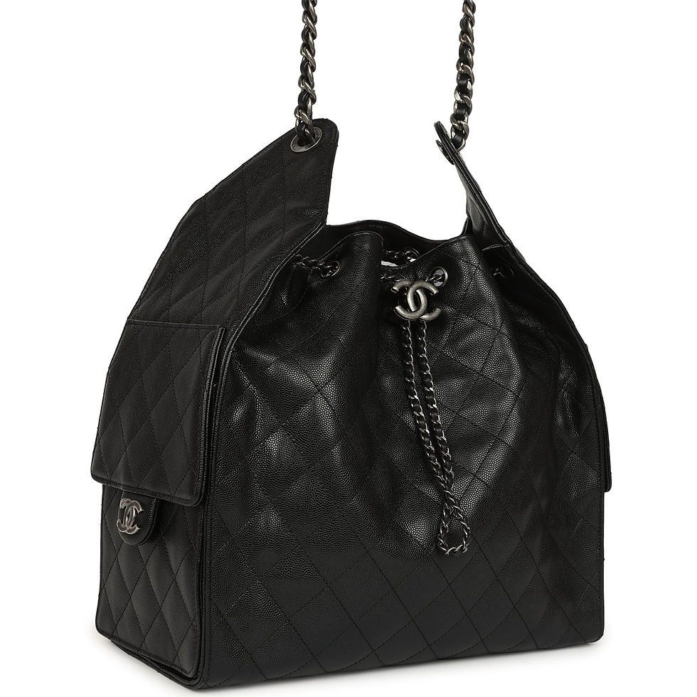 Angled front view showing the black quilted body, dark chain and side pocket