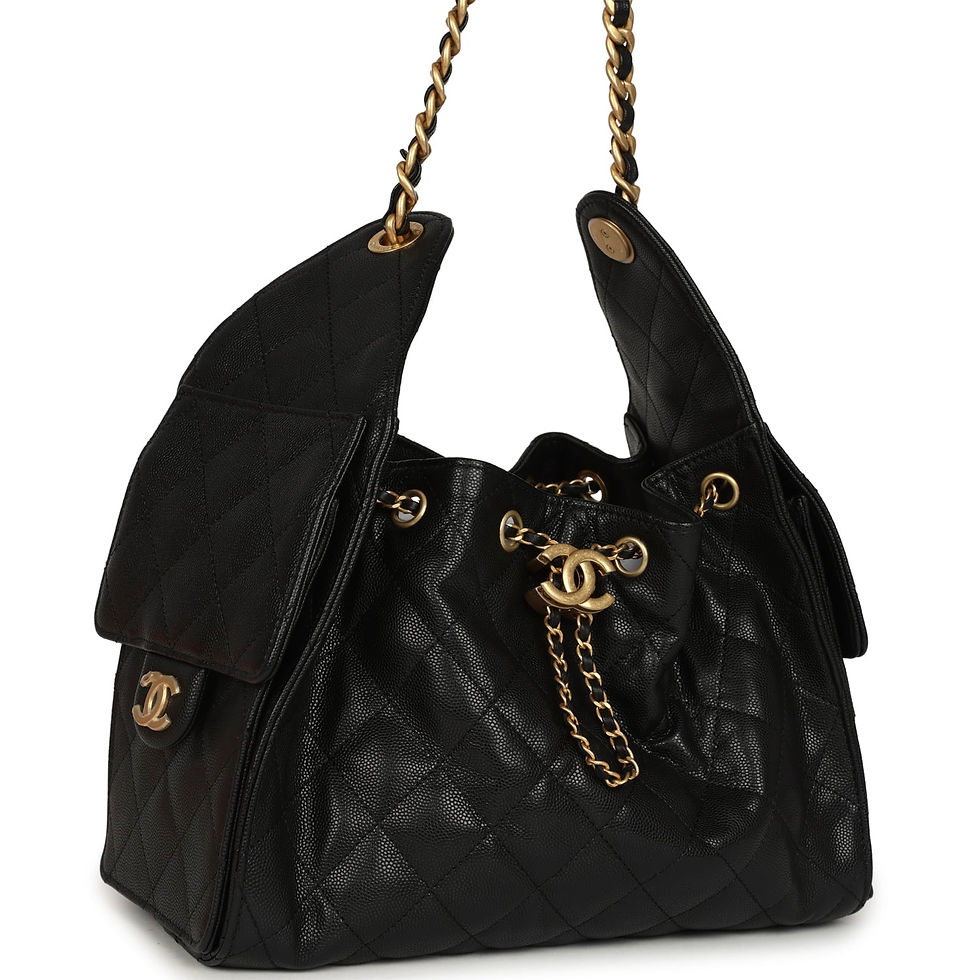 Three-quarter view of the black caviar hobo bag showing the side flap pocket and chain strap