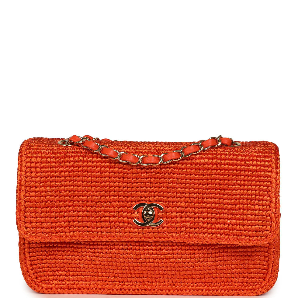 Chanel Coco Beach flap bag in orange braided raffia with gold chain strap