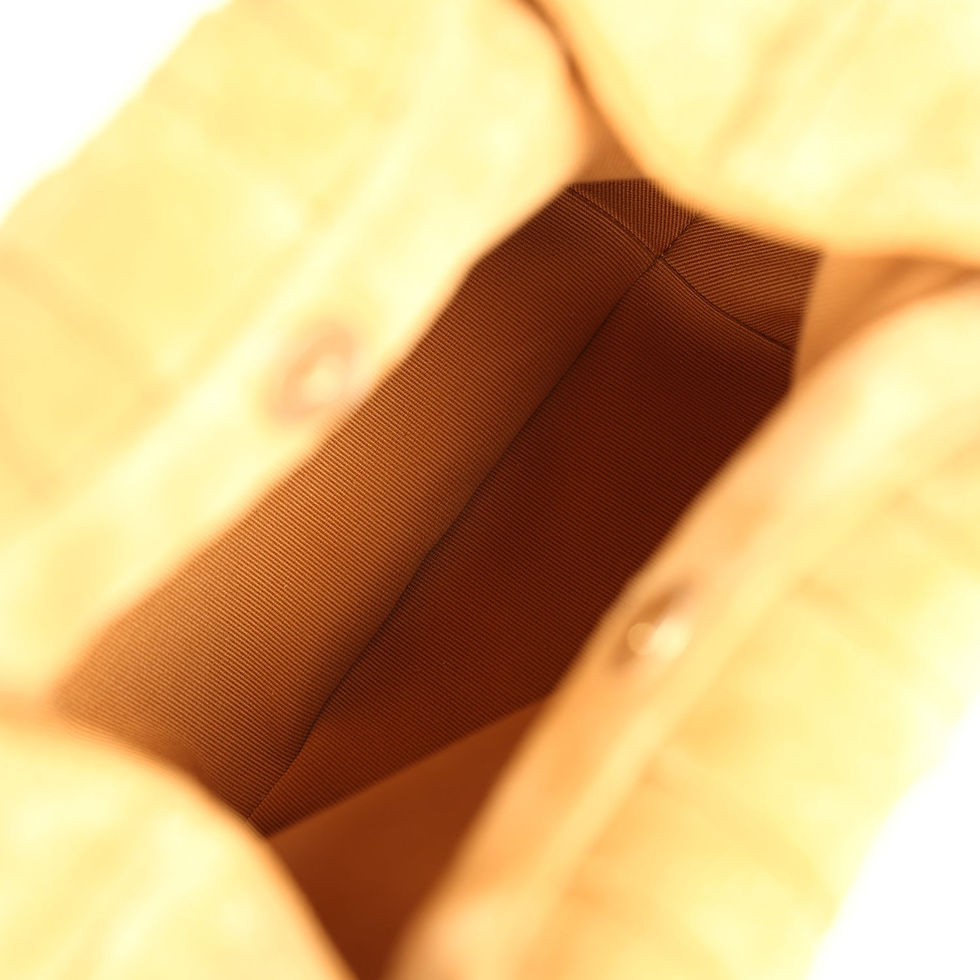 Thumbnail: Interior view of the beige suede pouch showing the fabric lining and snap closure