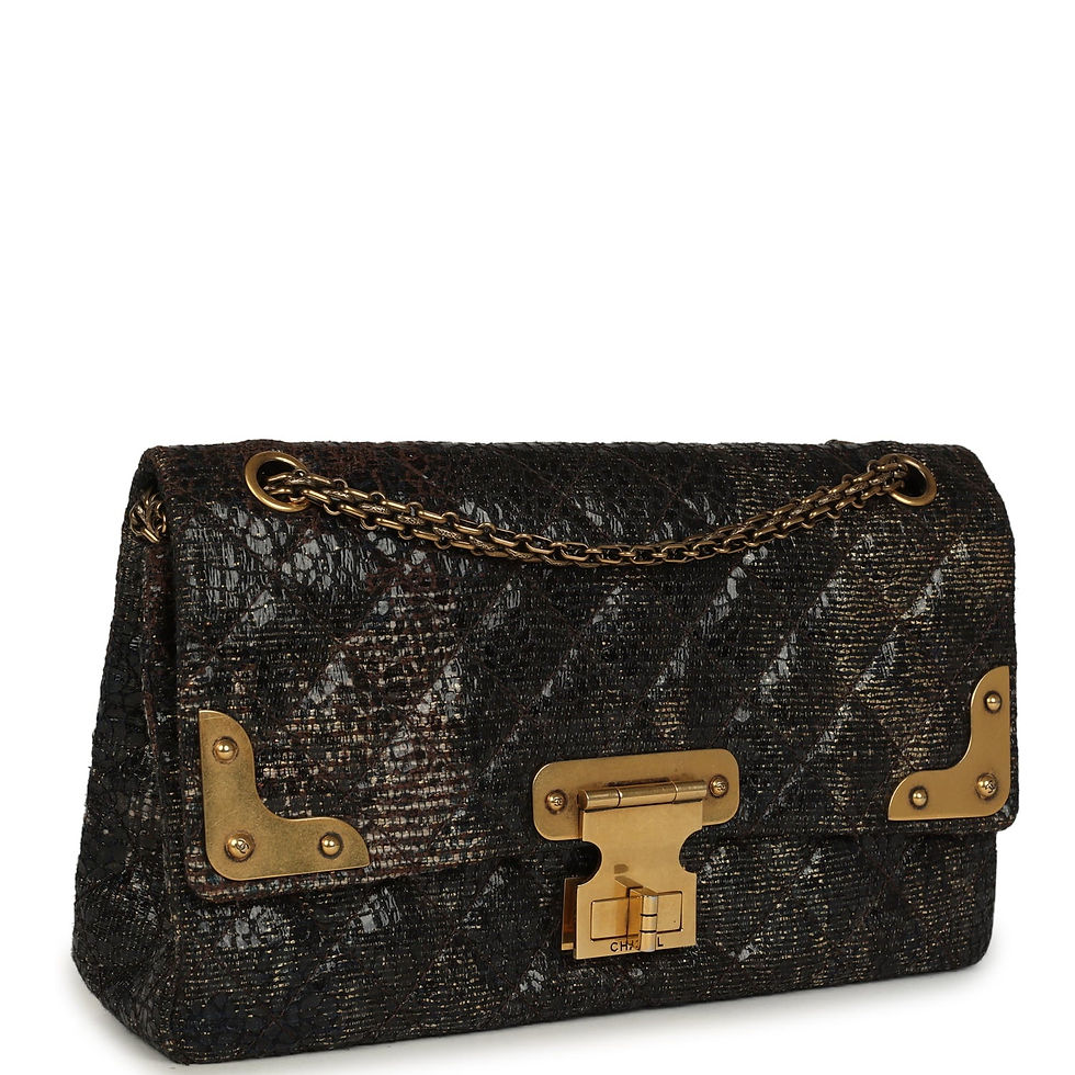 Three-quarter angled view showing the diamond-quilted tweed and engraved bar closure