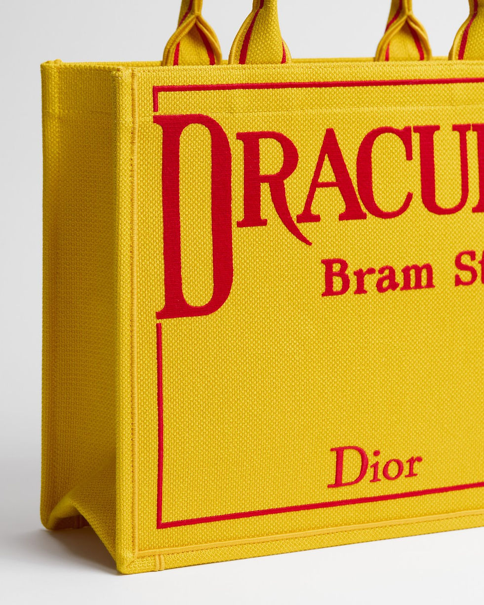Thumbnail: Dior Medium Book Tote in yellow embroidered canvas with Dracula cover – side detail