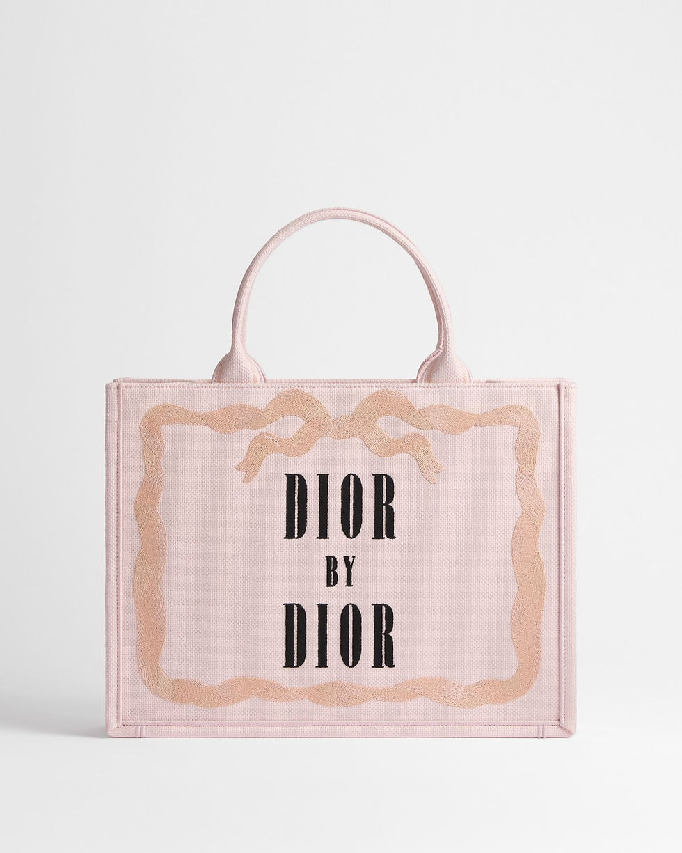 Dior Medium Book Tote in pink cotton with Dior by Dior book cover – front view