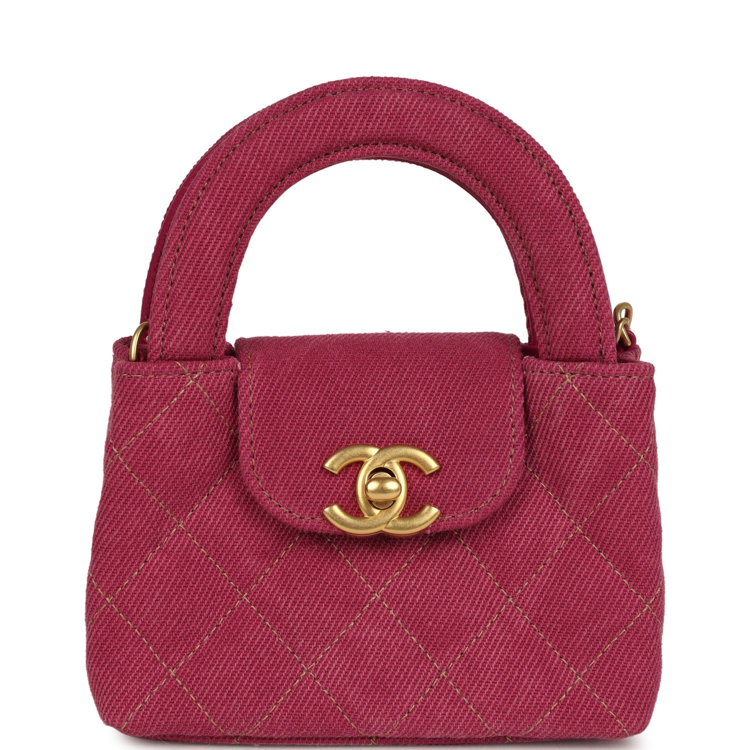 Chanel Nano Kelly Shopper in fuchsia washed denim with its rounded top handle and CC turn-lock
