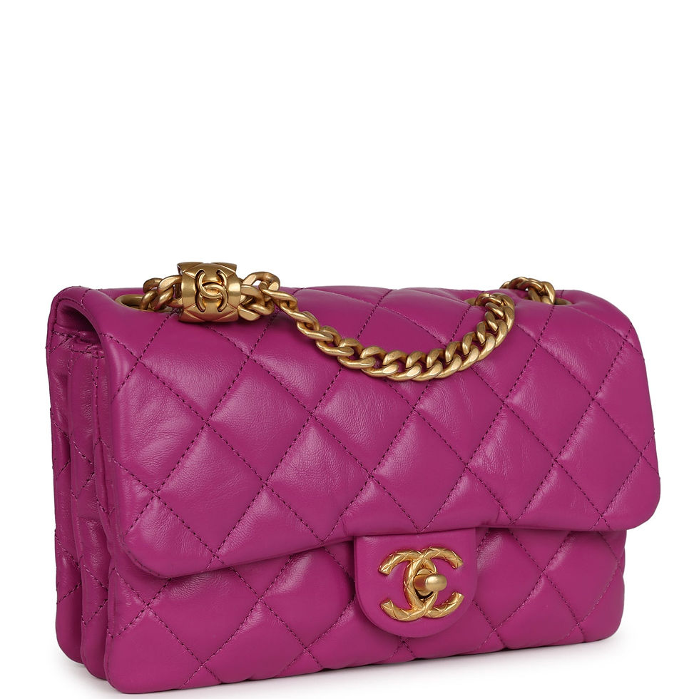 Three-quarter angled view showing the diamond-quilted purple calfskin and curb-link chain strap