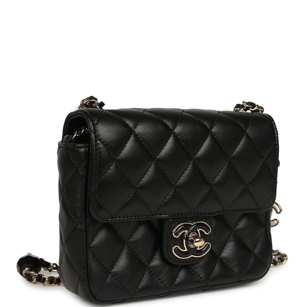 Three-quarter angled view showing the diamond-quilted black lambskin and beaded charm strap