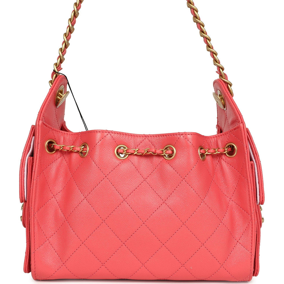 Thumbnail: Back view of the coral pink caviar hobo bag on its gold-tone chain straps
