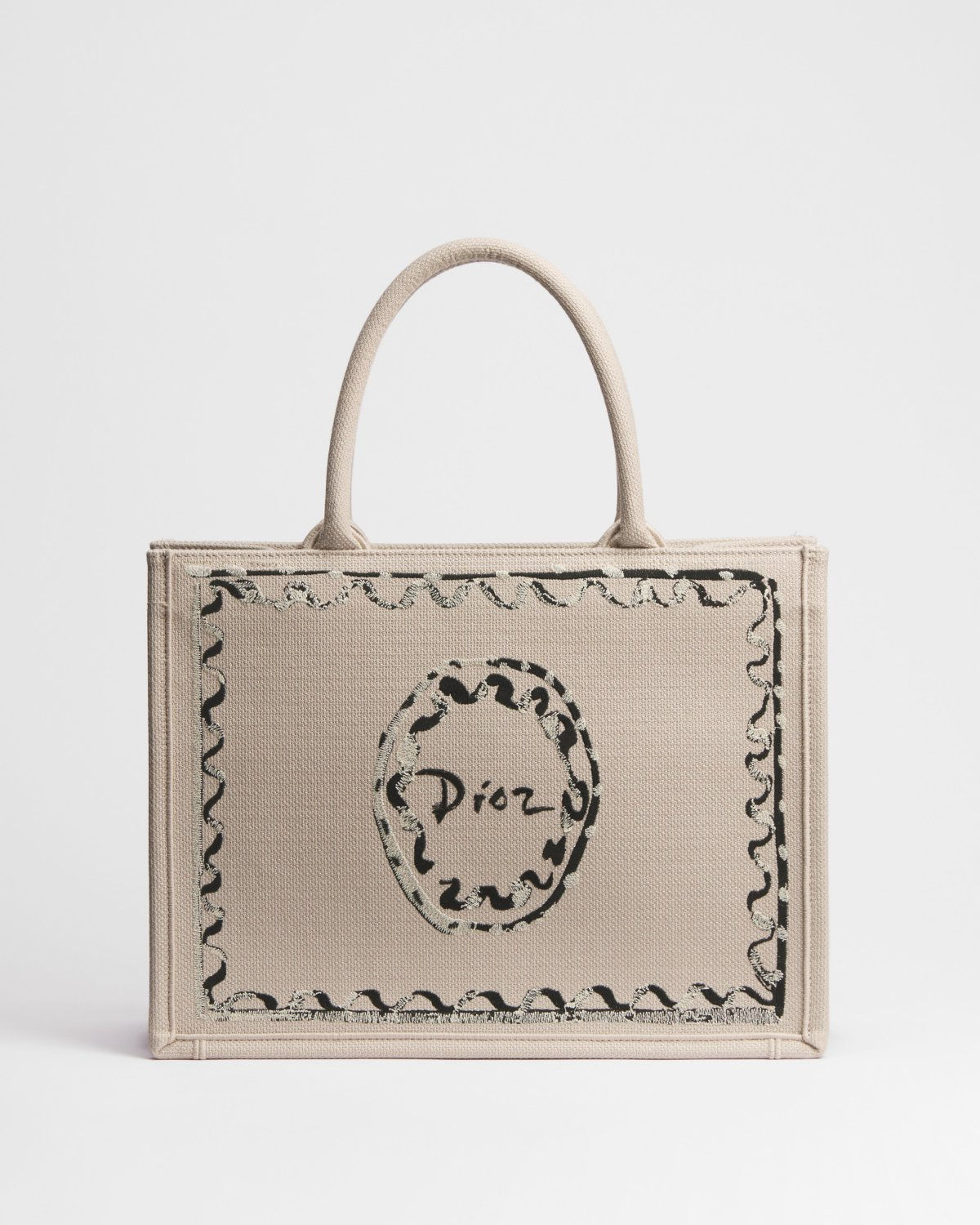 Dior Dioriviera Medium Book Tote in beige cotton with Dior Painted Ribbon motif – front view